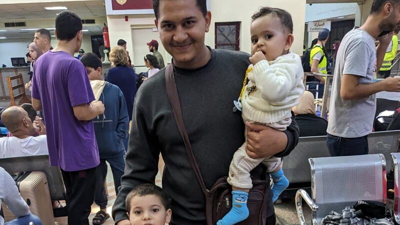 Mohammed Jendia , the brother-in-law of Belfast-born Palestinian Khalid El-Estal, crossing the border from Gaza into Egypt with Khalid's two young children Ali (4) and Sara (1).