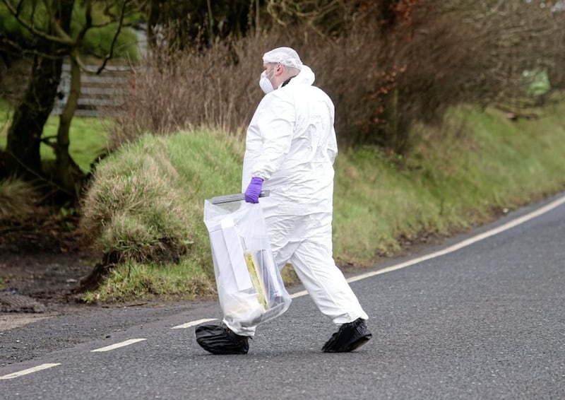 Police and forensic teams at the scene of the murder of David Murphy who was shot twice with a shotgun at his home in Glenwherry, Co Antrim Picture Mal McCann. 