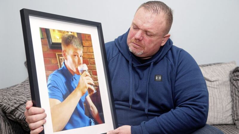 Christopher Connor holds a picture of his son Aaron (21) who died last Saturday. Picture by Mal McCann 