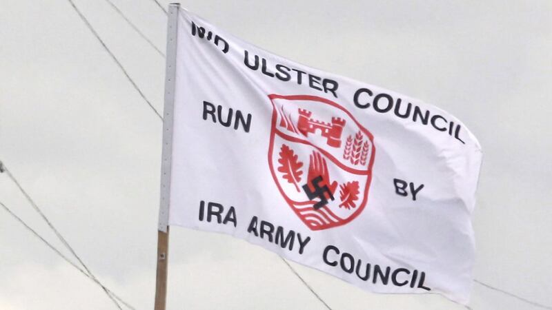 A flag criticising Mid Ulster District Council was placed on top of a bonfire in the Ballysally estate in Coleraine, Co Derry<br />&nbsp;