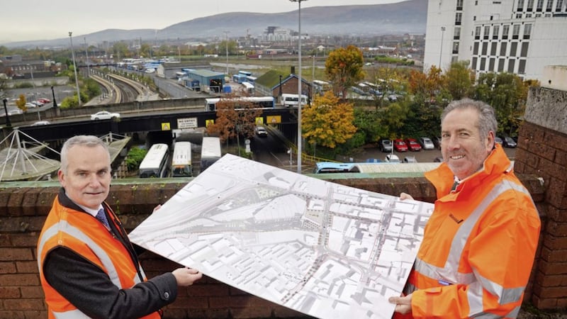 Translink chief executive Chris Conway and Graham&#39;s civil engineering managing director Leo Martin at the site of the Belfast Transport Hub with a copy of the master plan. Photo: Aaron McCracken 