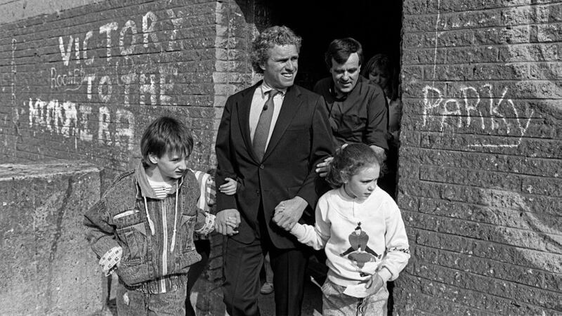 Congressman Joe Kennedy, father of the new US Envoy, being shown around Divis flats, west Belfast by Fr Matt Wallace in 1988. Picture: Pacemaker 