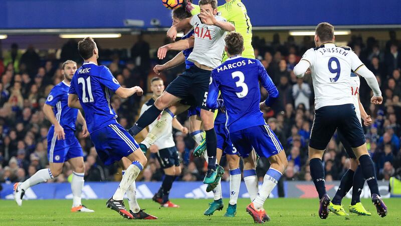 Chelsea's Gary Cahill (centre left) and Thibaut Courtois (centre right) battle for the ball in the air with Tottenham Hotspur's Jan Vertonghen (centre) during the Premier League match at Stamford Bridge, London.&nbsp;