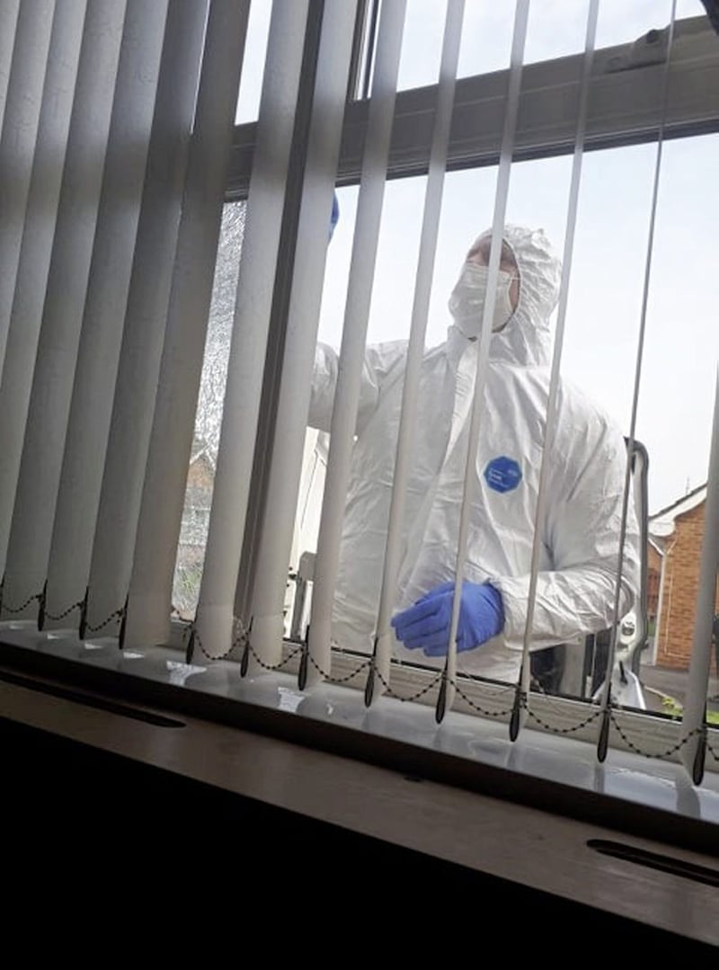 A forensic officer at work following a gun attack on Colin Duffy&#39;s home 