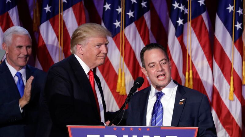 Reince Priebus, then chair of the Republican National Committee, right, speaks as President-elect Donald Trump gives his acceptance speech during his election night rally in New York. Picture by John Locher, Associated Press&nbsp;
