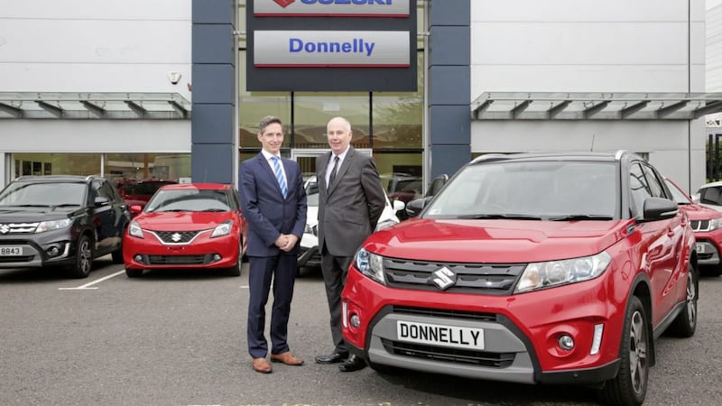 Paul Compton, site director at Donnelly Group Boucher Road and Stephen Robinson, national sales manager at Suzuki GB PLC at the new Donnelly Suzuki showroom at Boucher Road. 