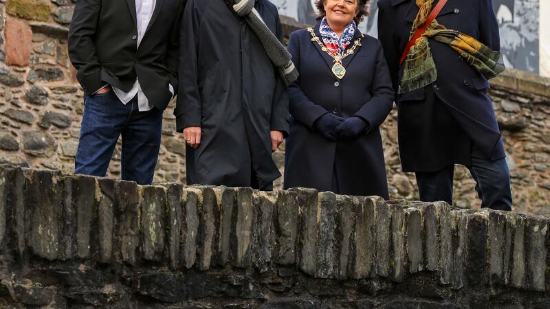 Derry mayor Patricia Logue with Billy Doherty, Damien O'Neill and Mickey Bradley from the Undertones at a new mural dedicated to the group. 