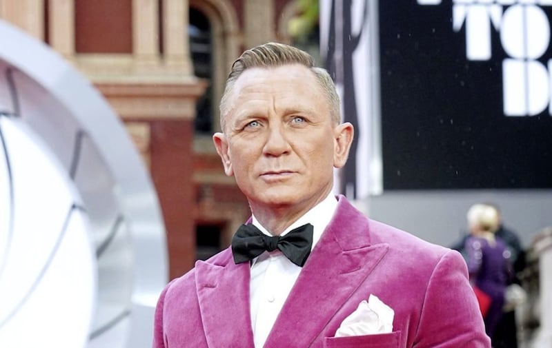Daniel Craig in a dreamy pink velvet tuxedo jacket at the world premiere of No Time To Die