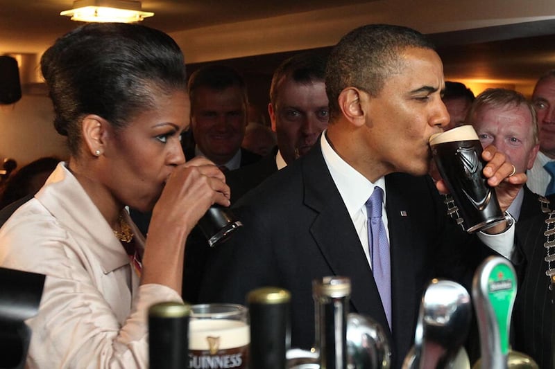 President Barack Obama and First Lady Michelle Obama enjoying a Guinness in Hayes Bar in Moneygall, County Offaly, during their visit to Ireland. Picture date: Monday May 23 2011