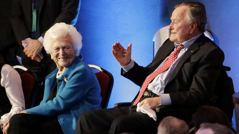 Former President George H. W. Bush, right, and his wife, Barbara, are greeted before a Republican presidential primary debate at The University of Houston in Houston in February, 2016.&nbsp;<br />(AP Photo/David J. Phillip)&nbsp;