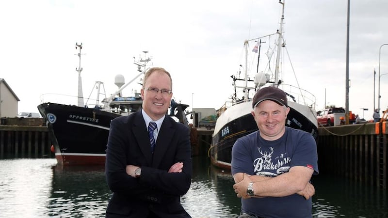 Keith Thompson, left, of Ulster Bank and Bill Coffey in Portavogie with The Opportune 