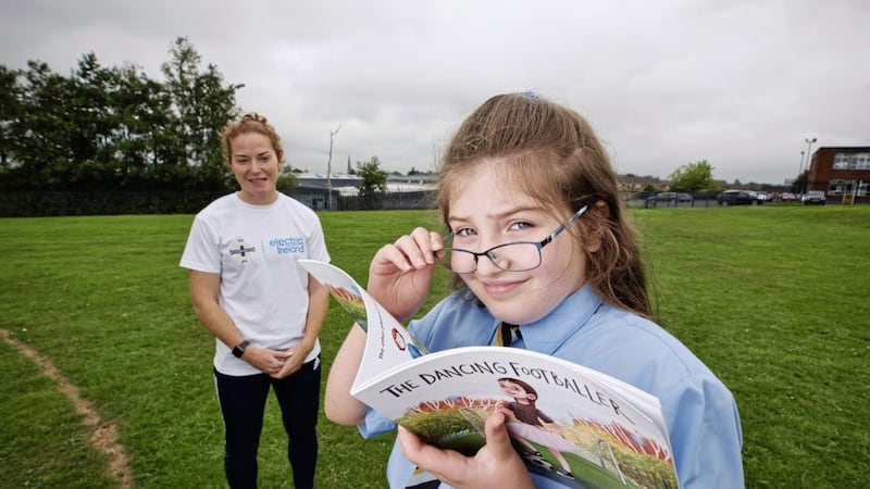Northern Ireland Women&rsquo;s captain Marissa Callaghan with Sarah Dickson, winner of the Electric Ireland Shooting for the Stars children&rsquo;s writing competition. 