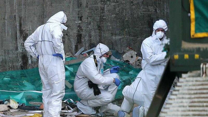 Forensic officers at the Greenstar recycling facility in Bray, County Wicklow, Ireland, where suspected remains of a newborn baby have been discovered. Picture by Niall Carson/PA Wire