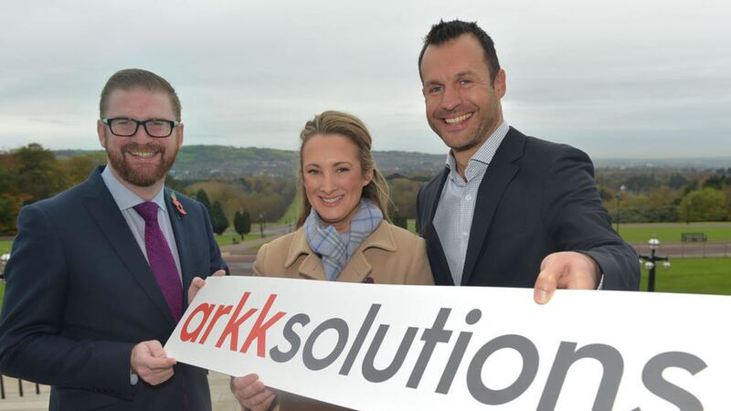 Simon Hamilton, left, welcomes Arkk Solutions Belfast expansion plans with Lucy Gordon, general manager of Arkk Solutions Belfast office and MD Andy Gent 