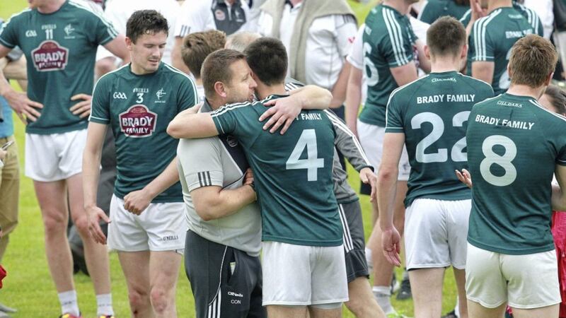 Kildare manager Cian O&#39;Neill hugs his players on the final whistle after beating Derry during the All Ireland Senior Championship round 1 qualifier.. Picture by Margaret McLaughlin. 