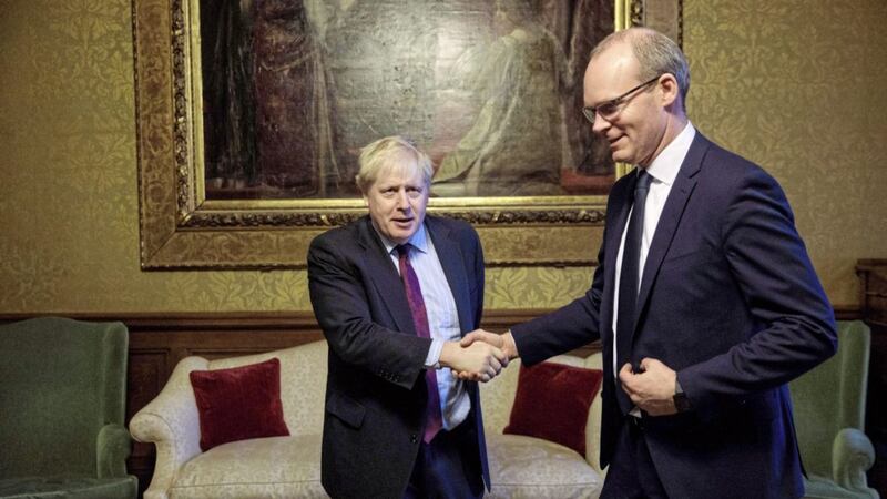 Foreign Secretary Boris Johnson greets T&aacute;naiste Simon Coveney ahead of talks at the Foreign and Commonwealth Office in London yesterday<br />PICTURE: Jack Taylor/PA
