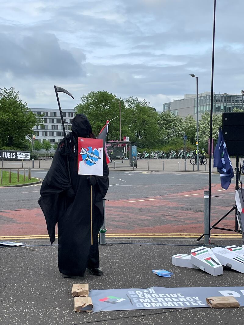 A demonstrator dressed as the Grim Reaper, as protesters gather outside the Barclays AGM at the SEC in Glasgow