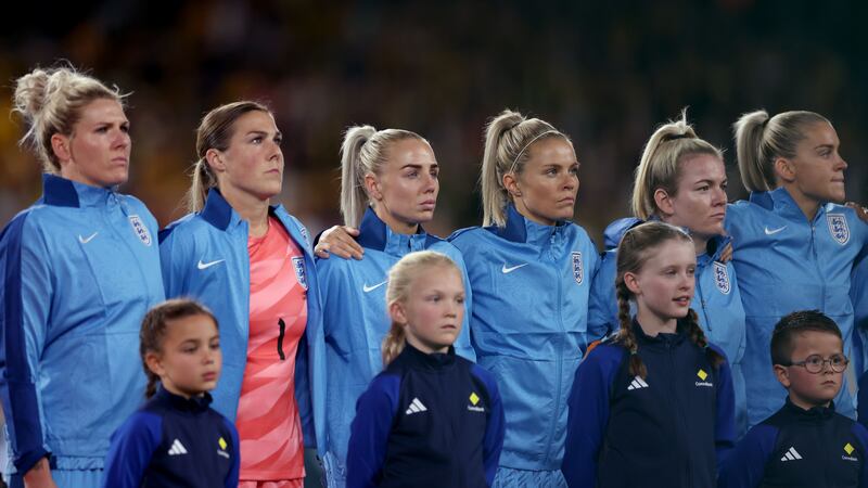 The England team sing the national anthem (PA)