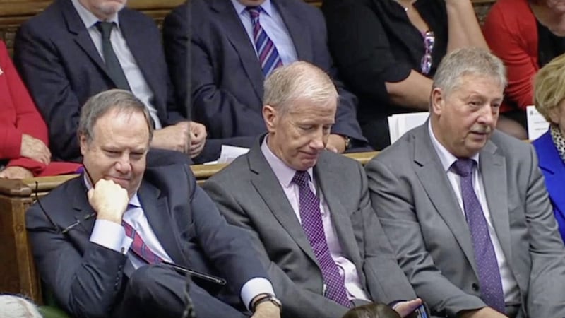 DUP MPs Nigel Dodds, Gregory Campbell, and Sammy Wilson listen as Prime Minister Boris Johnson delivers a statement about his Brexit deal in the House of Commons on Saturday. Picture by House of Commons/PA Wire 