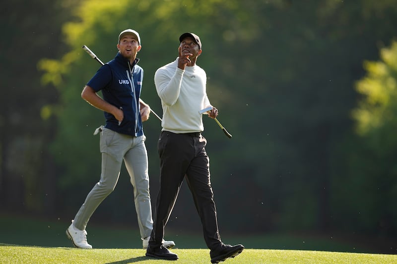 Will Zalatoris, left, and Tiger Woods walk to the 12th green during a practice round ahead of the 88th Masters (George Walker IV/AP)