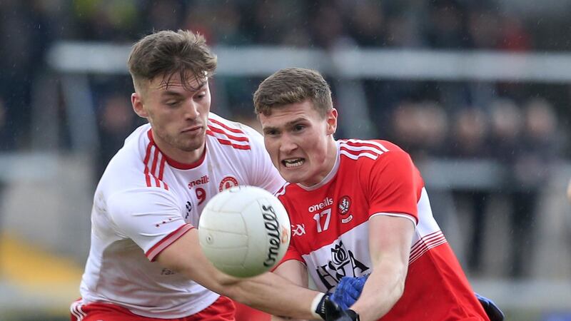 Tyrone Brian Kennedy's and Derry's Jack Doherty in action at the Athletic Grounds Picture by Philip Walsh