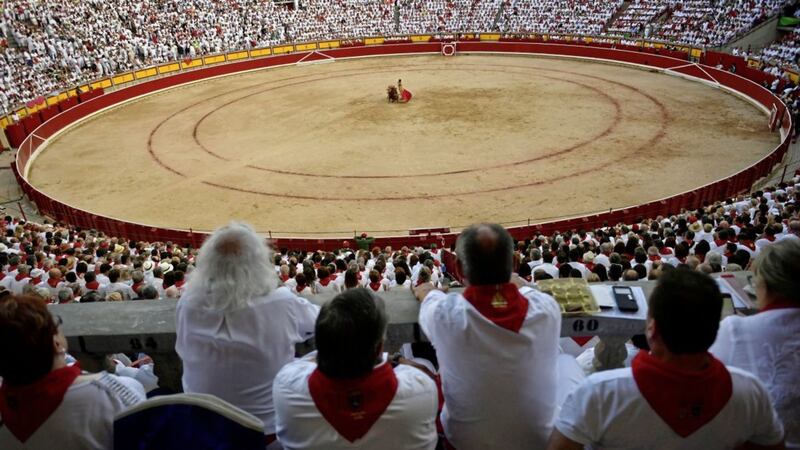 Spanish bullfighting Gines Martin performs with a Nunez del Cuvillo&#39;s fighting bulls during a bullfight at the San Fermin Festival, in Pamplona, northern Spain. Picture by Alvaro Barrientos, Associated Press 