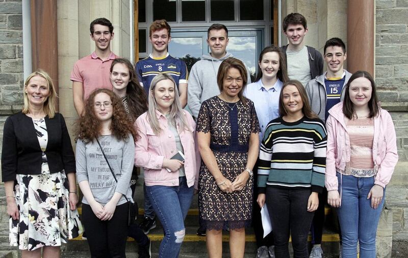 Students from Lumen Christi College, Derry, who achieved 11 A*/A grades with principal Siobhan McCauley (centre)