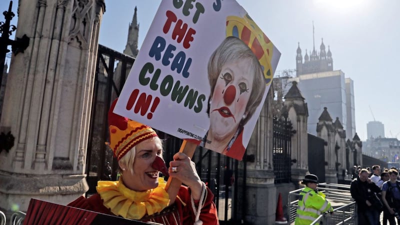 A demonstrator protests at the entrance of the Houses of Parliament in London on Tuesday, February 26, 2019. T&aacute;naiste Simon Coveney introduced a debate on the Brexit Bill in the D&aacute;il as British Prime Minister Theresa May offered MPs a chance to vote to delay Britain's exit from the EU <br />Picture by Frank Augstein/AP