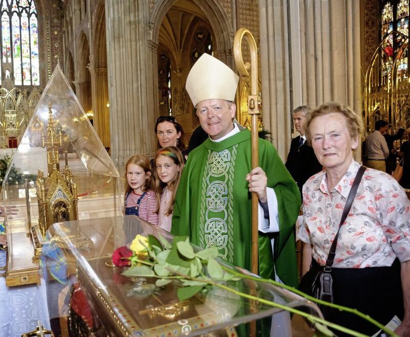 Archbishop Eamon Martin with Lucy Lyons, Grace Lyons, Paula Lyons and Roisin McAnenly at the relics of Saints Louis and Z&eacute;lie Martin and St Th&eacute;r&egrave;se of Lisieux. Picture by www.LiamMcArdle.com 
