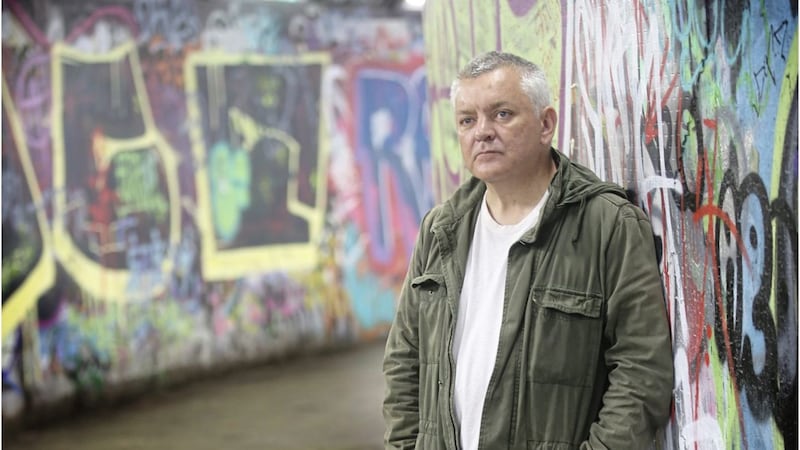 Journalist and author Henry McDonald pictured at Belfast High Street subway, where he often used to hang out as a punk in his youth. The location also features in his new novel Two Souls. Picture by Hugh Russell