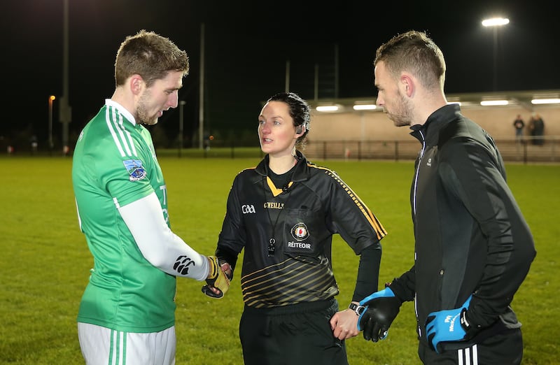 Tossing the coin at her first senior men's game with Fermanagh skipper Eoin Donnelly and St Mary's captain Matthew Fitzpatrick