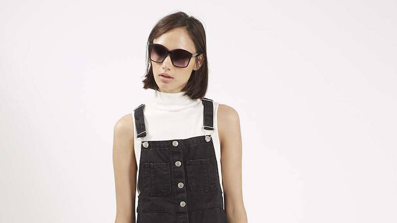 The MOTO Black Midi Denim Pinafore Dress, available from Topshop 