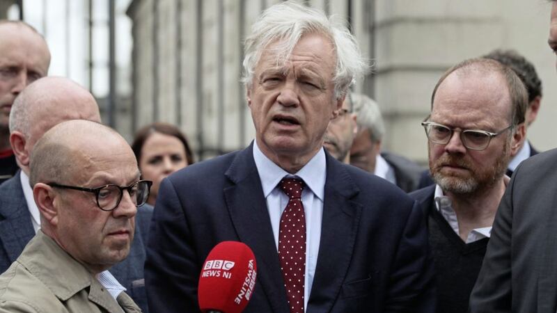 Conservative MP and former Brexit Secretary David Davis (centre) with journalists Trevor Birney and Barry McCaffrey. Picture by Brian Lawless/PA Wire 