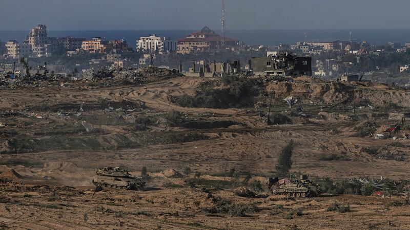 Israeli army vehicles on the edge of the Gaza Strip (Tsafrir Abayov/AP)