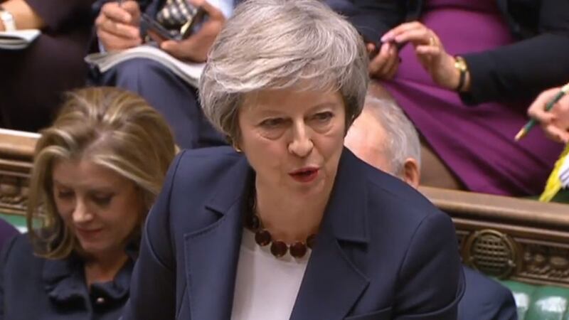 Theresa May pictured this afternoon during Prime Minister's Questions at the House of Commons in London&nbsp;