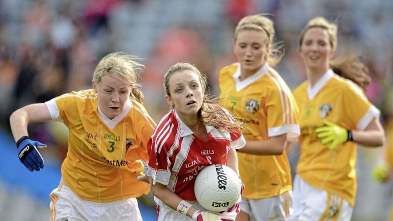 Wearing the Antrim colours, Emma Kelly (left) homes in on Louth&rsquo;s Ciara O'Connor in the 2012 TG4 All-Ireland Ladies Football JFC Final at Croke Park.<br /> Photo: Stephen McCarthy/ Sportsfile