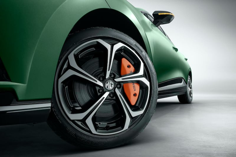 A view of the MG4 XPower's 18" Cyclone alloy wheel with orange "XPOWER"-branded brake calliper