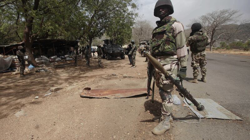Nigerian soldiers man a checkpoint in Gwoza, Nigeria, last year, a town newly liberated from Boko Haram. Picture by Lekan Oyekanmi, Associated Press