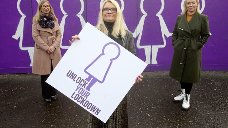 Sarah Mason, Sandra McNamee, and Kelly Andrews from Women&#39;s Aid at the launch the new `Unlock Your Lockdown&#39; mural on Donegall Street in Belfast city centre. Picture by Mal McCann 