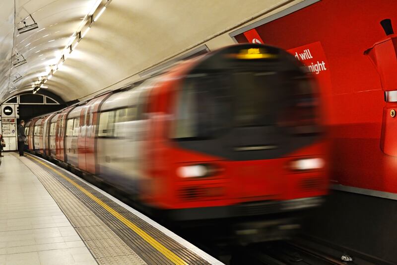 DHKH27 London Underground Train Pulling into a Station, Charing Cross, London, Uk.
