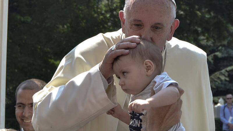 Pope Francis kisses a baby in Sarajevo, Bosnia-Herzegovina on Saturday June 6 2015. Pope Francis urged Bosnia&#39;s Muslims, Orthodox and Catholics to put the &quot;deep wounds&quot; of their past behind them and work together for a peaceful future 