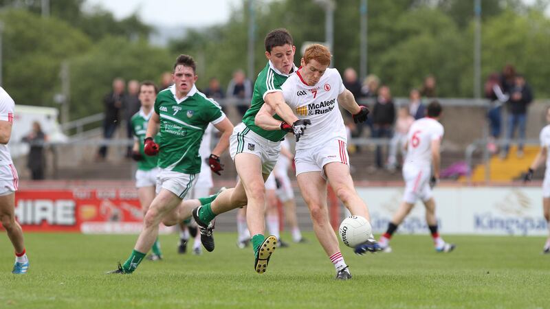 Tyrone's Peter Harte gets his shot away despite the best efforts of Limerick's Gear&oacute;id Hegarty during Sunday's Qualifier at Healy Park<br/>Picture: Colm O&rsquo;Reilly&nbsp;