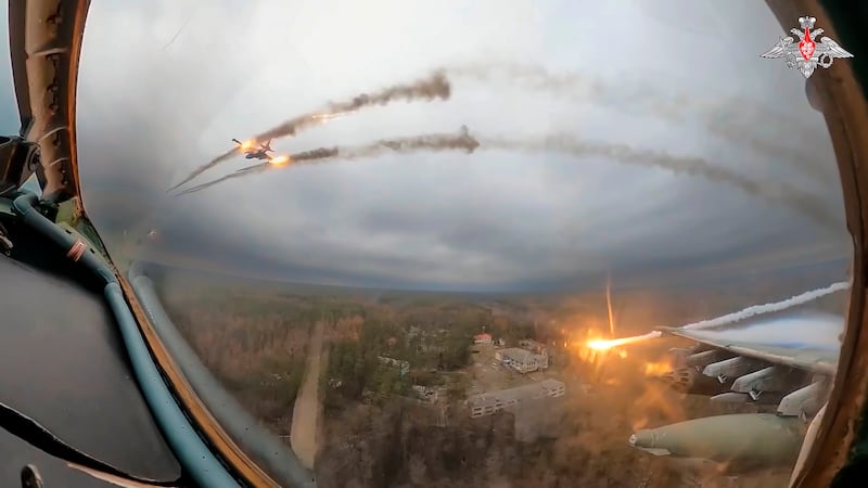 A Su-25 plane is seen firing rockets over Ukraine (Russian Defence Ministry Press Service via AP)