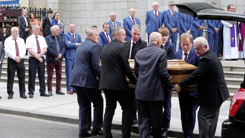 Former Down GAA players form a guard of honor at the the funeral of Newry businessman Brian Conlon. Picture by Mal McCann 