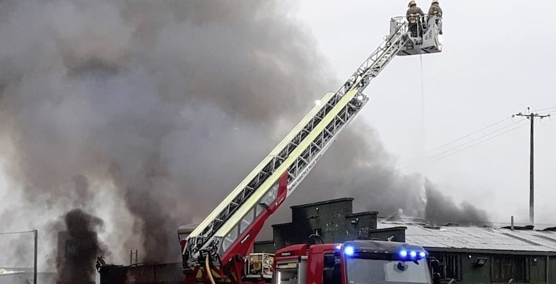 An aerial appliance is used to douse the flames. Picture by Pacemaker 
