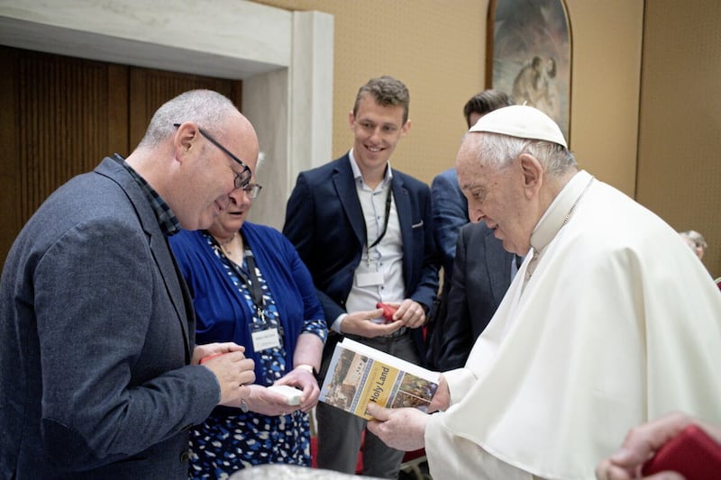 Michael Kelly presenting Pope Francis with a copy of his guide to the Holy Land. 