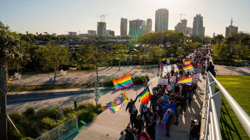 People march toward the St Pete Pier in St Petersburg, Florida, in March, 2022, during a protest against the controversial “Don’t Say Gay” bill passed by Florida’s Republican-led legislature (Martha Asencio-Rhine/Tampa Bay Times via AP/PA)