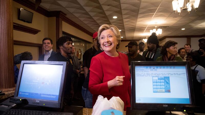 Democratic presidential candidate Hillary Clinton smiles as she speaks with an employee of Angie's Soul Cafe in Cleveland. Picture by Andrew Harnik, Associated Press&nbsp;