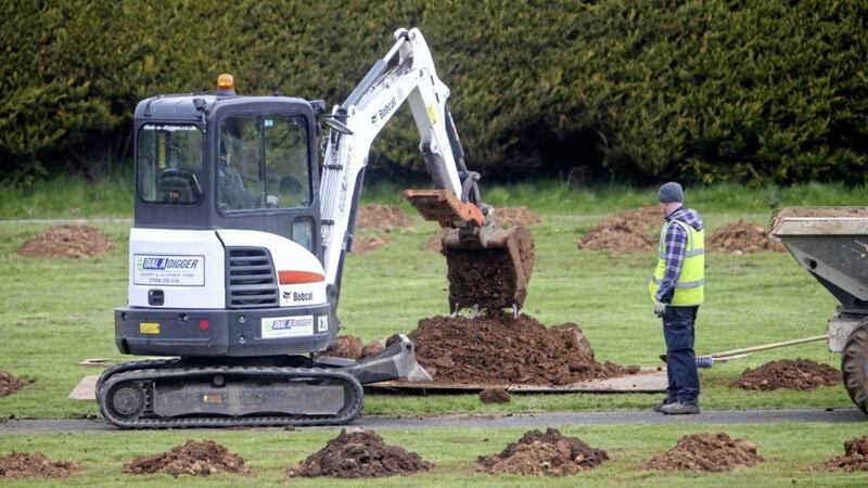 Multiple graves being prepared at Sixmile Cemetery in Antrim. Picture by Mal McCann 