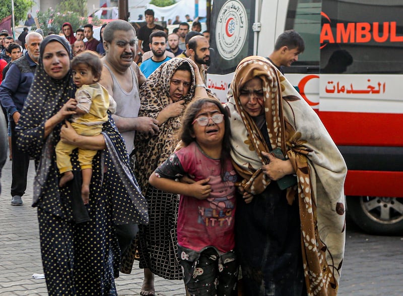 Injured Palestinians arrive at al-Shifa Hospital (Abed Khaled/AP)